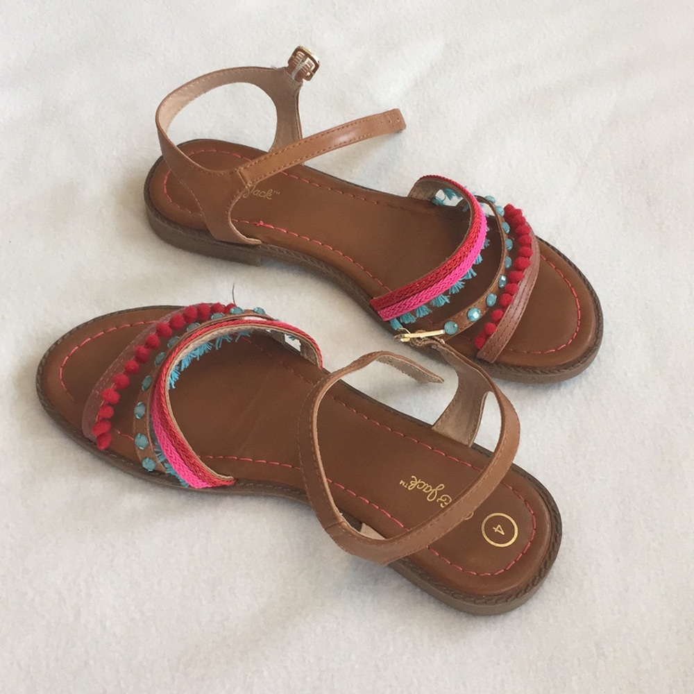 Stylish pink,red, and teal summer sandals.